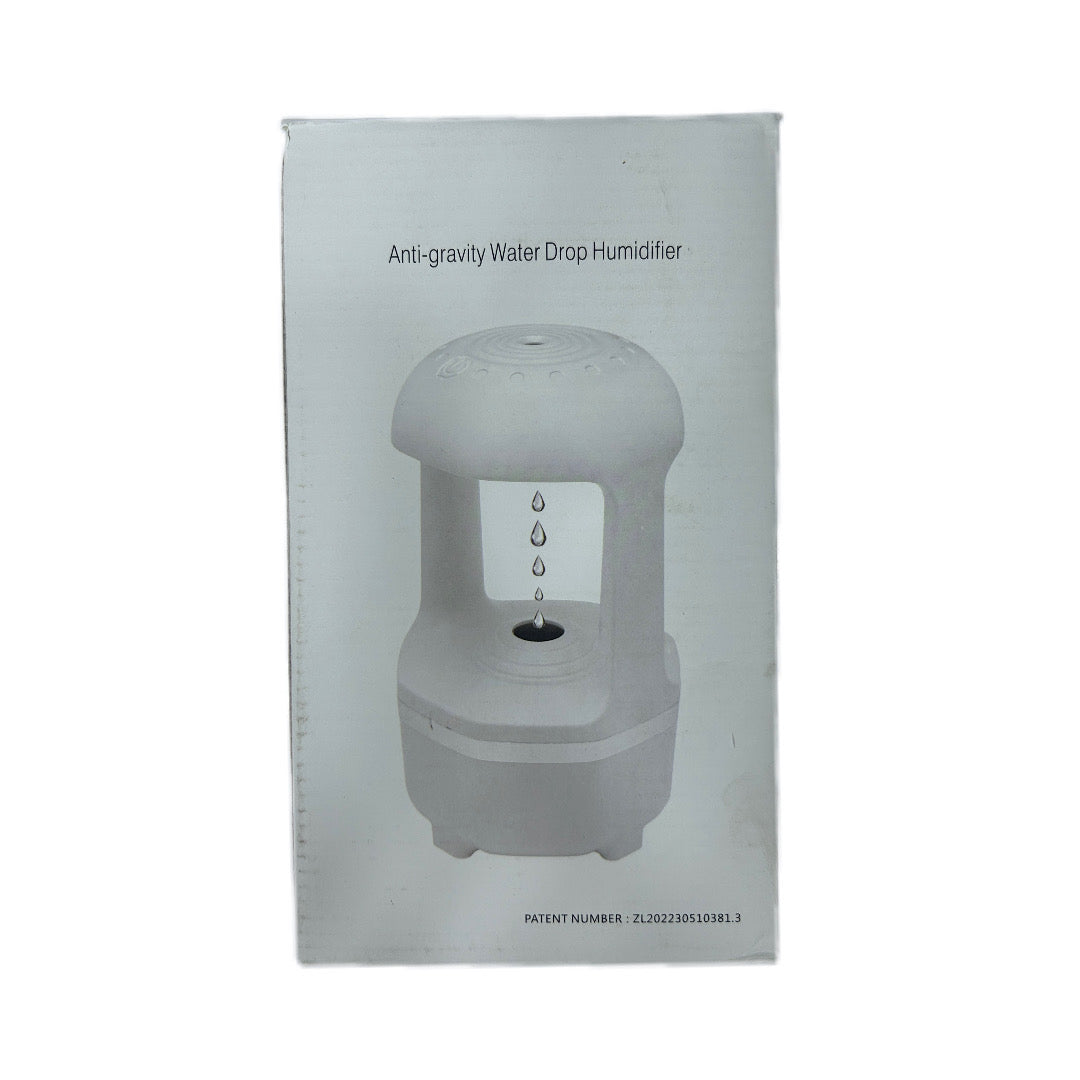 Box packaging of an anti-gravity water drop humidifier with product image and text on a white background.